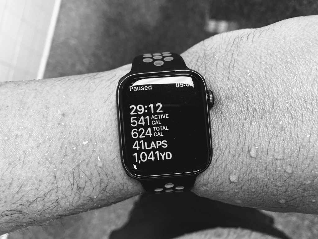 Image of an Apple smart watch showing the statistics for a 1,041 yard swim done in 29 minutes, 12 seconds, burning 541 active calories and 624 total calories in 41 laps.