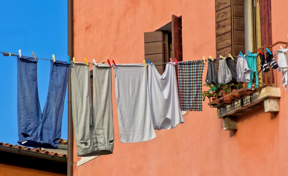 Clothes hanging from a line outside a building
